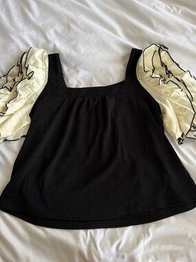Sunday in Brooklyn (Anthropologie) Black top with white ruffle sleeves